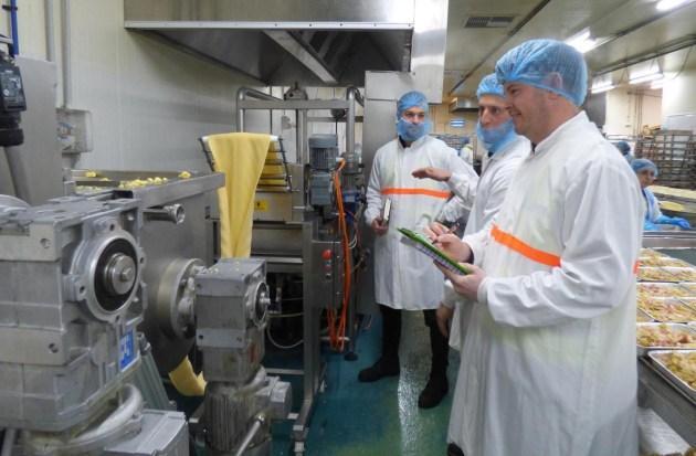 Nitin Aras food processing consultants conducting plant audit and machinery inspection inside a manufacturing facility.